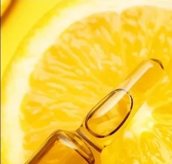 Citrus and serum imagery representing vitamin C